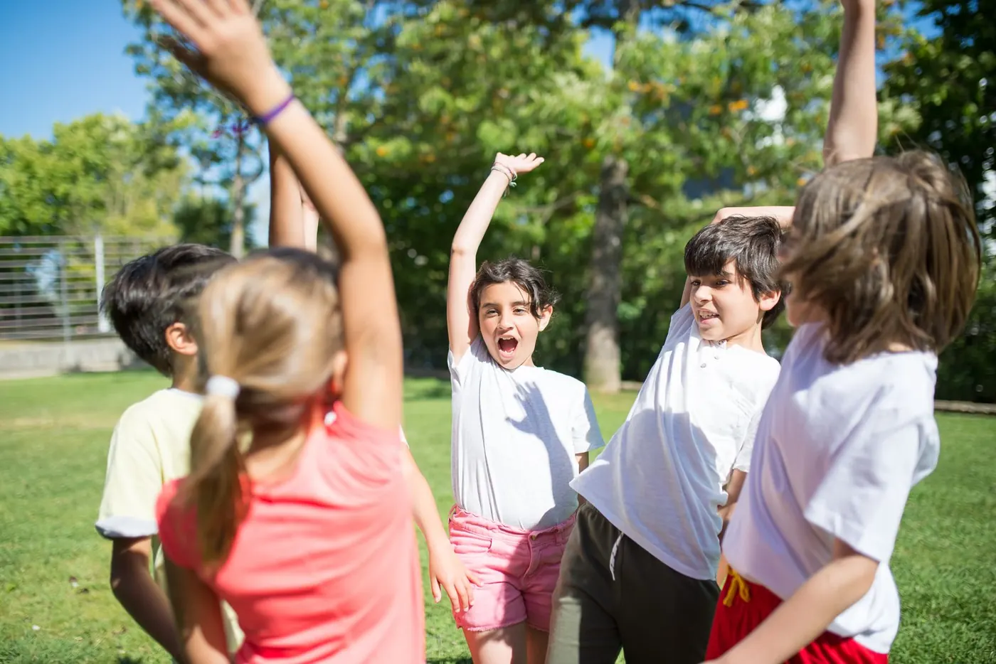 Children playing outdoors in a park, illustrating everyday habits that support immunity